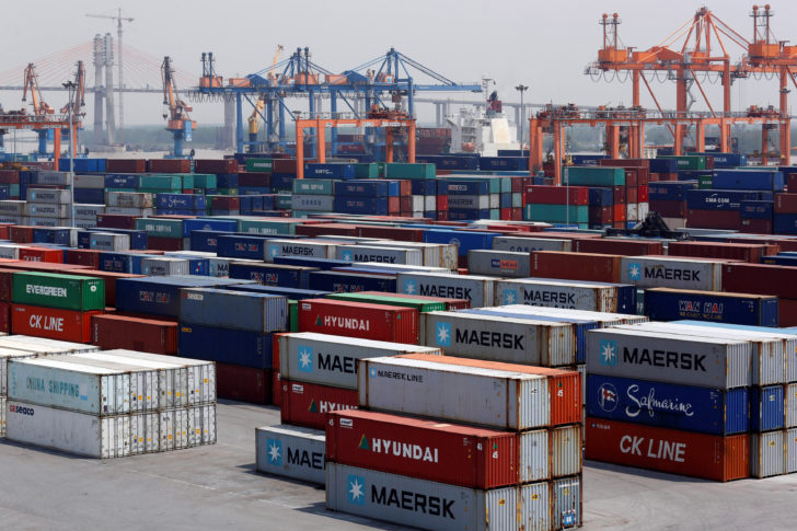 Shipping containers are seen at a port in Hai Phong city