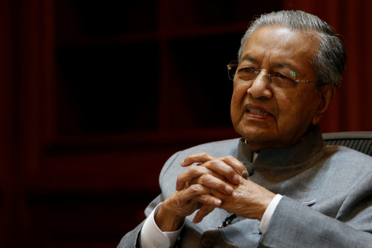 FILE PHOTO: Malaysia's Prime Minister Mahathir Mohamad speaks during an interview with Reuters in Putrajaya