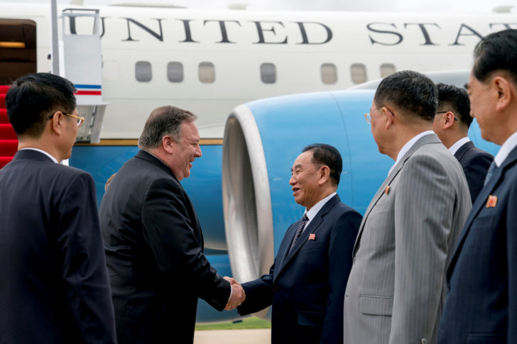 U.S. Secretary of State Mike Pompeo is greeted by North Korean Director of the United Front Department Kim Yong Chol as he arrives at Sunan International Airport in Pyongyang