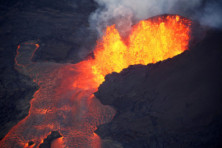 FILE PHOTO: Lava erupts in Leilani Estates during ongoing eruptions of the Kilauea Volcano in Hawaii