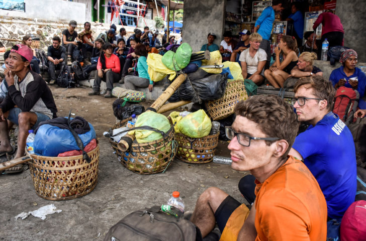 Indonesian and foreign climbers are seen after walking down from Rinjani Mountain at Sembalun village in Lombok Timur