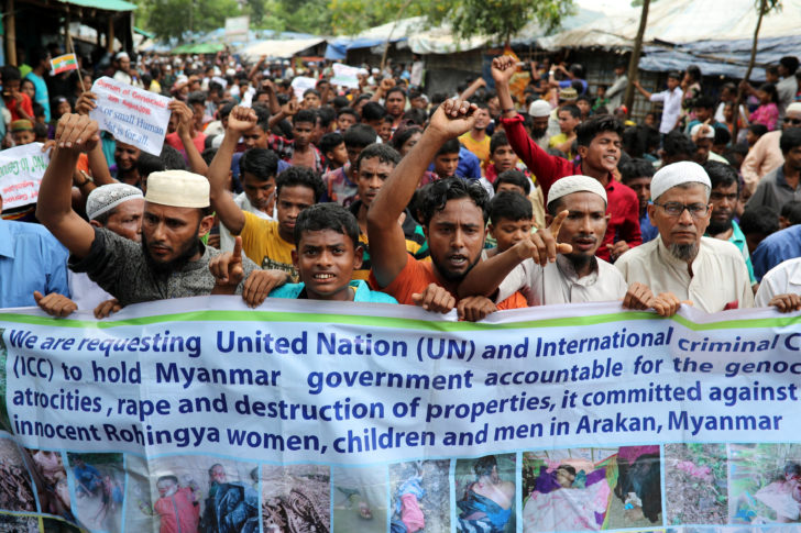 Rohingya refugees take part in a protest at the Kutupalong refugee camp to mark the one year anniversary of their exodus in Cox's Bazar