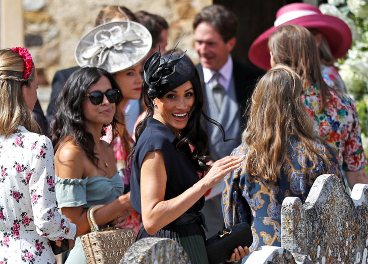 Britain's Meghan, Duchess of Sussex, arrives at the wedding of Charlie Van Straubenzee and Daisy Jenks at the Church of St. Mary the Virgin, Frensham, in Surrey
