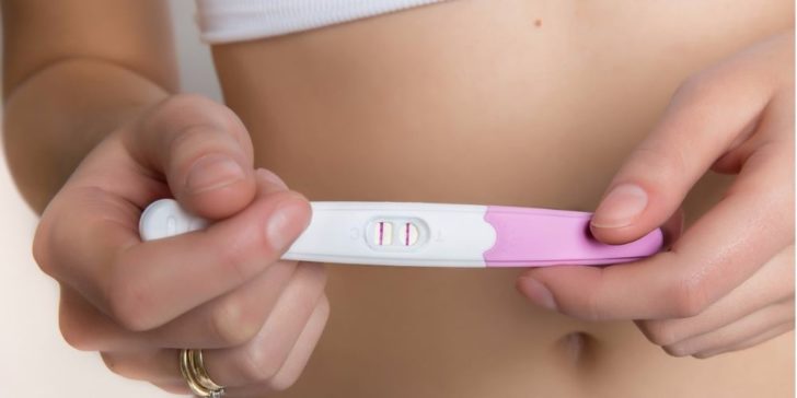 woman-holding-positive-pregnancy-test-picture-id491220532