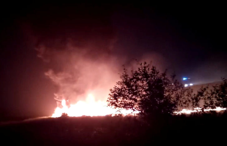 A plume of smoke rises from flames after an Utair Boeing 737 passenger plane made a rough landing and caught fire in Sochi