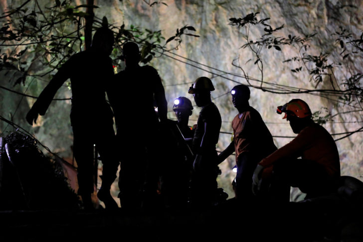 Rescue workers take a rest as they take out machines after 12 soccer players and their coach were rescued in Tham Luang cave complex in the northern province of Chiang Rai