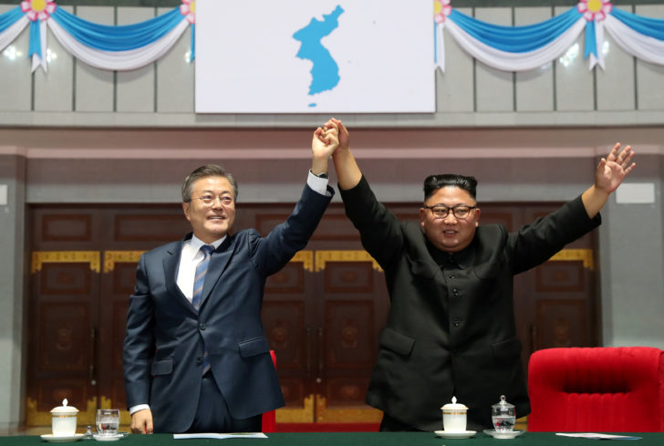 South Korean President Moon Jae-in and North Korean leader Kim Jong Un acknowledges the audience after watching the performance titled