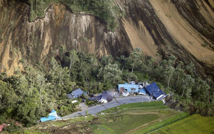 Houses damaged by a landslide caused by an earthquake, are seen in Atsuma town