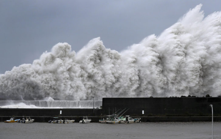 High waves triggered by Typhoon Jebi are seen at a fishing port in Aki