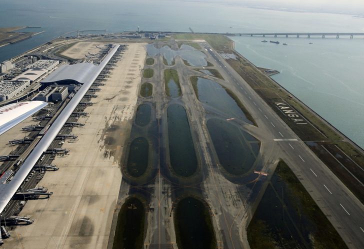 An aerial view shows a flooded runway at Kansai airport, which is built on a man-made island in a bay, after Typhoon Jebi hit the area, in Izumisano, western Japan