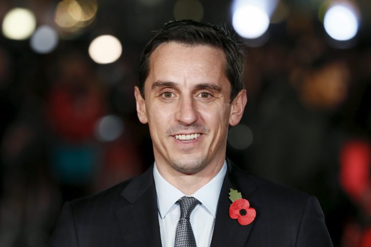 Former Manchester United player Neville poses for photographers on the red carpet at the world premiere of