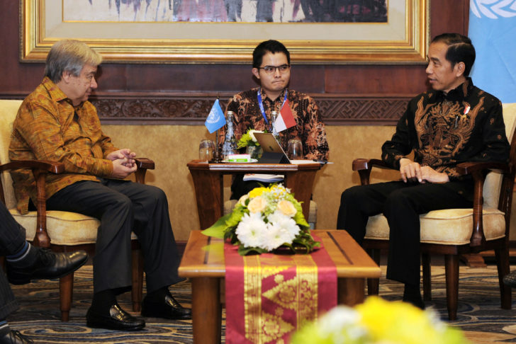 Indonesia President Joko Widodo speaks with UN general secretary Antonio Guterres during their bilateral meeting on the International Monitary Fund and World Bank annual meetings in Nusa Dua