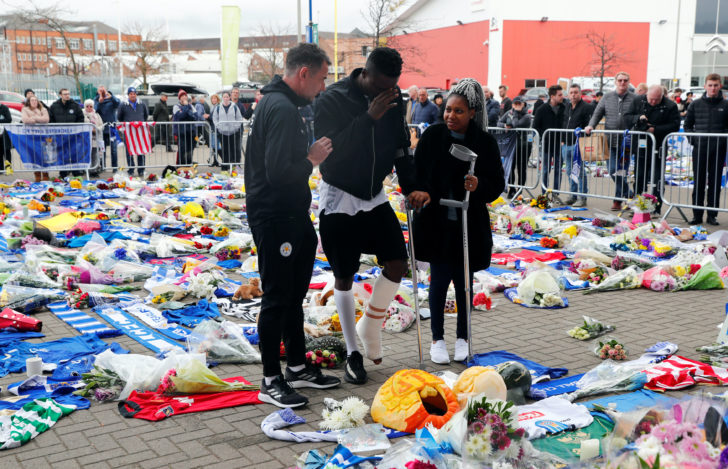 Leicester City player, Daniel Amartey, reacts as he views tributes after the club's owner Vichai Srivaddhanaprabha, and four other people died when their helicopter crashed on Saturday, in Leicester