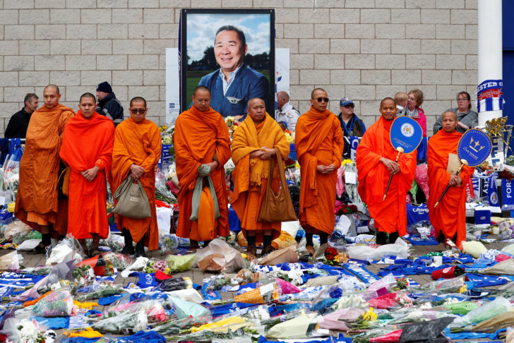 Bhuddhist monks stand in tribute after the club's owner Thai businessman Vichai Srivaddhanaprabha, and four other people died when their helicopter crashed as it left the ground after the match on Saturday, at the King Power Stadium, in Leicester
