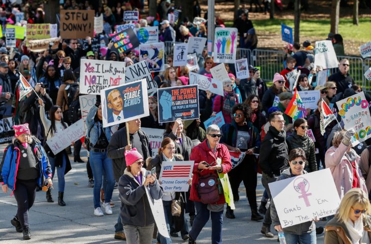 Thousands of women march against Trump as early voting begins in midterm election