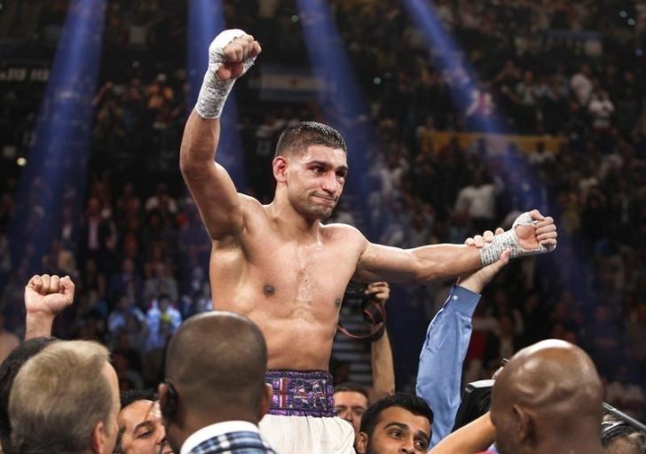 Amir Khan of Britain celebrates his victory over Luis Collazo of the U.S. after their welterweight fight at the MGM Grand Garden Arena in Las Vegas