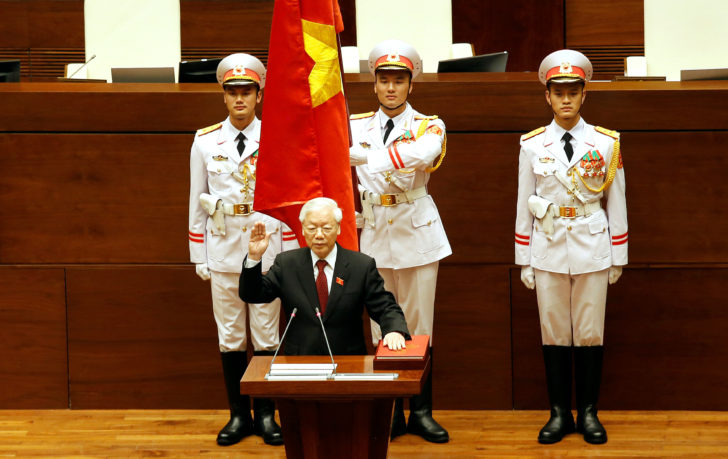 Vietnam's Communist Party General Secretary Nguyen Phu Trong takes his oath of office after being elected as Vietnam's State President during a National Assembly session in Hanoi