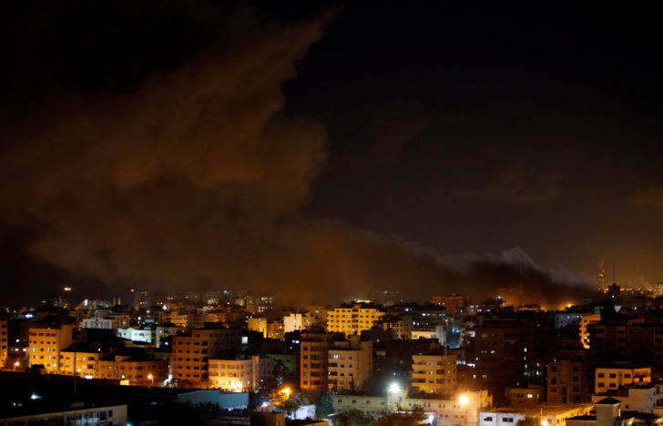 Smoke rises following an Israeli air strike on Hamas's television station, in Gaza City