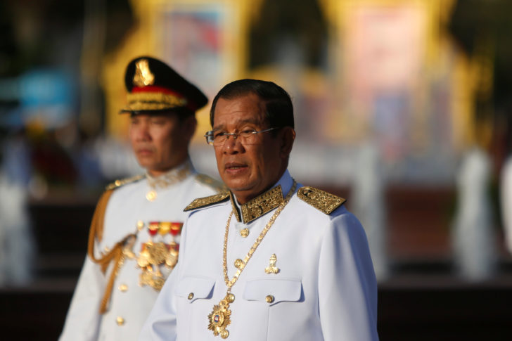 Cambodia's PM Hun Sen arrives to attend celebrations marking the 65th anniversary of the country's independence in Phnom Penh