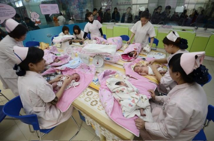 FILE PHOTO: Infants undergo a daily medical examination at a maternal and child health care hospital in Taiyuan