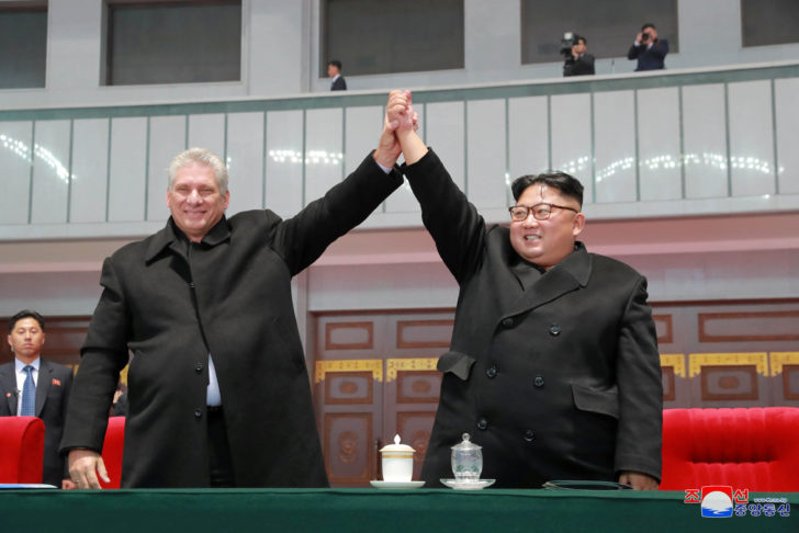 Cuban President Miguel Diaz-Canel is seen with North Korean leader Kim Jong Un as they attend the grand gymnastics and artistic performance