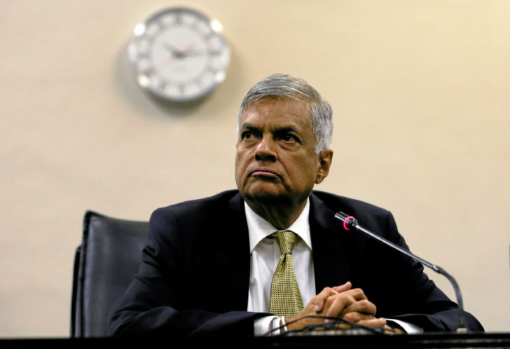 FILE PHOTO: Sri Lankan Prime Minister Wickremesinghe looks at a news conference after he survived a no confidence vote in parliament in Colombo