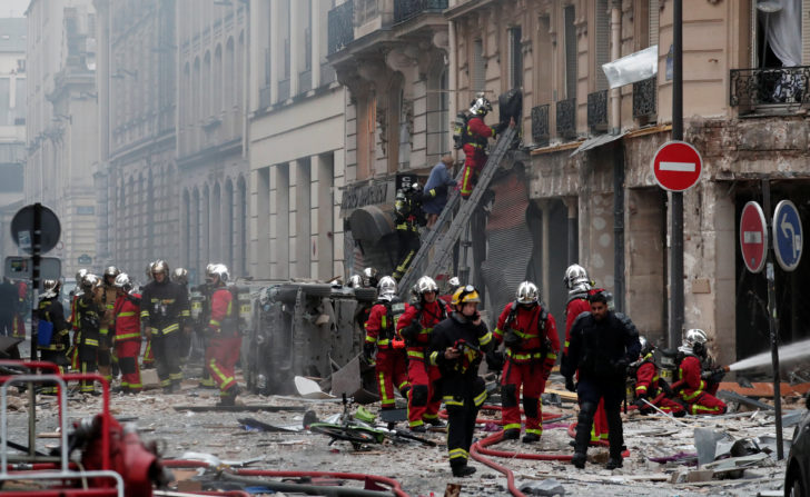 Firemen work at the site of an explosion in a bakery shop in the 9th District in Paris