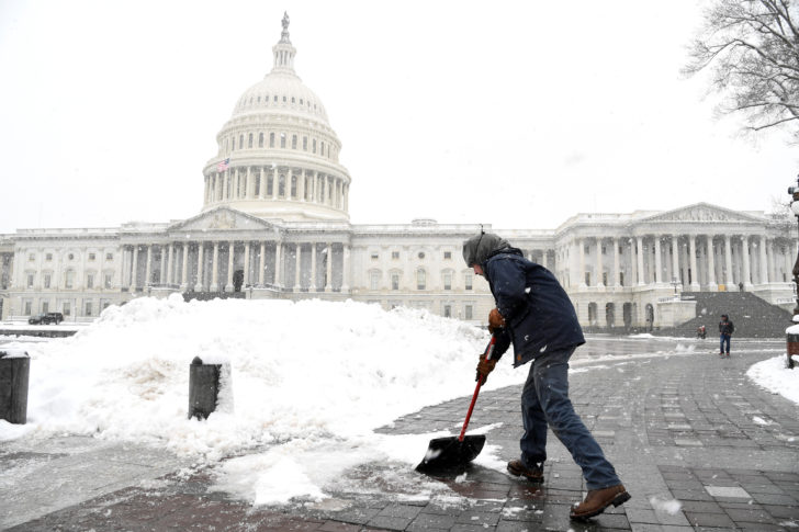 Snow is cleared at U.S. Capitol during Winter Storm Gia in Washington DC