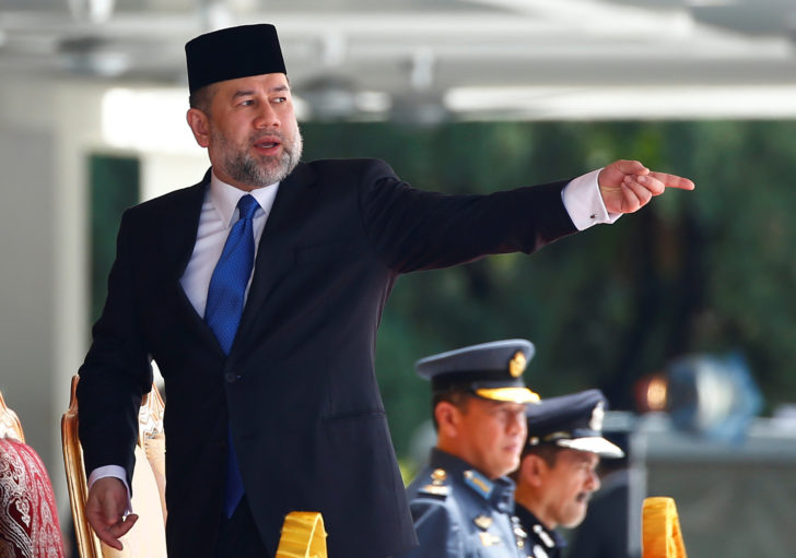 Malaysian King Muhammad V attends a welcome ceremony at the Parliament House in Kuala Lumpur