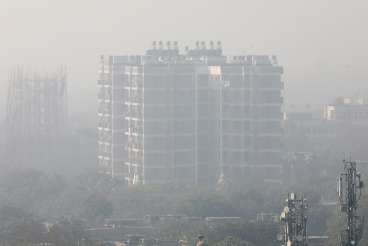 FILE PHOTO: A residential building is shrouded in smog in New Delhi