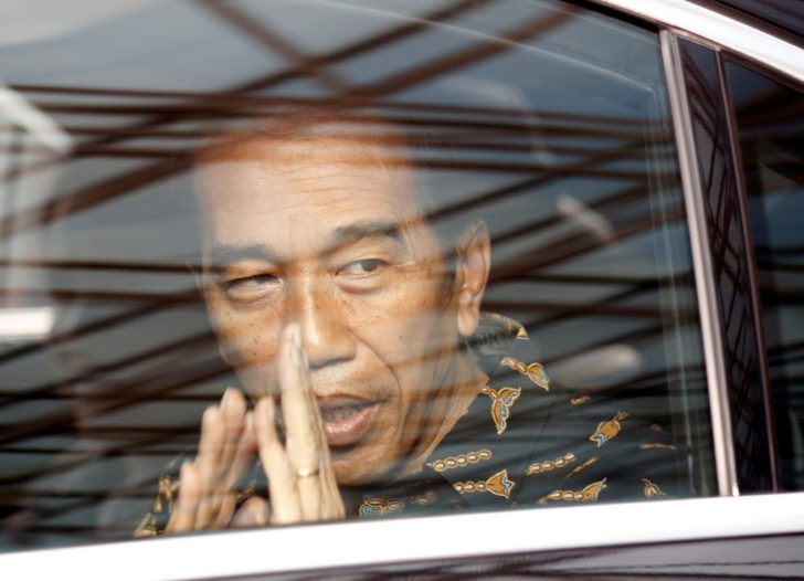 Indonesian President Joko Widodo leaves after visiting former first lady Ani Yudhoyono at a hospital in Singapore