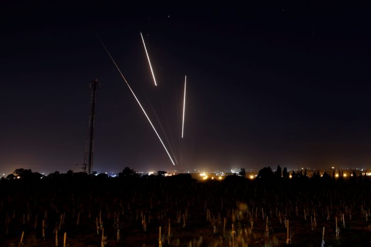 Streaks of light are pictured as rockets are launched from the Gaza Strip towards Israel, as seen from the Israeli side of the border