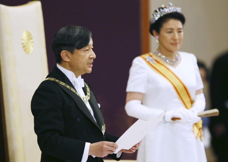 Japan's Emperor Naruhito walks in front of Crown Prince Akishino as he leaves a ritual called Kenji-to-Shokei-no-gi, a ceremony for inheriting the imperial regalia and seals, at the Imperial Palace in Tokyo