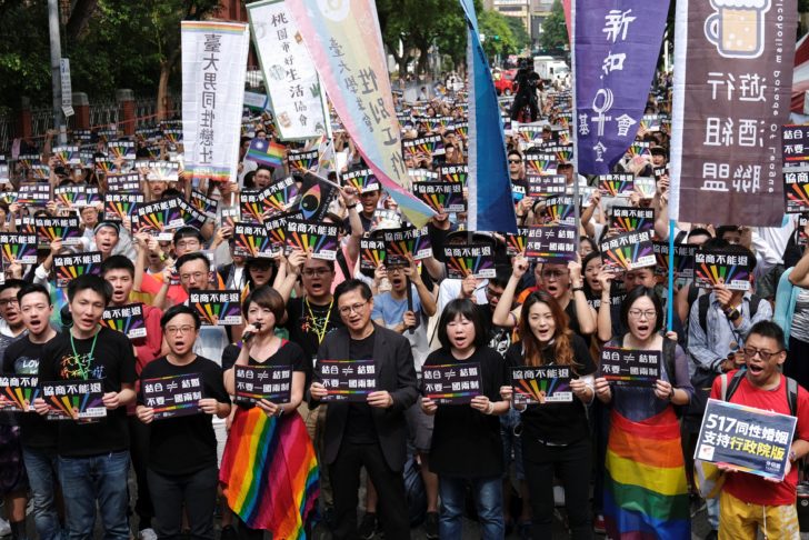Same-sex marriage supporters take part in a rally during parliament discussion on three different draft bills of a same-sex marriage law, outside the Legislative Yuan in Taipei