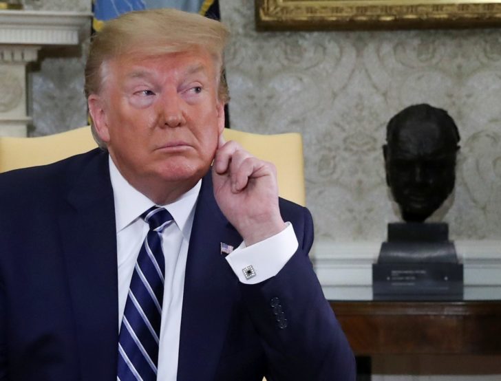 U.S. President Trump listens during Oval Office meeting at the White House in Washington