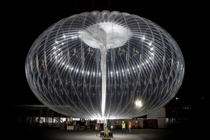 Handout photo workers standing near a Loon balloon nside a building at Moffett Federal Airfield in Mountain View, California
