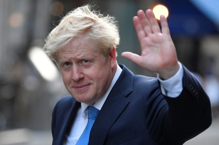Boris Johnson, leader of the Britain's Conservative Party, leaves a private reception in central London