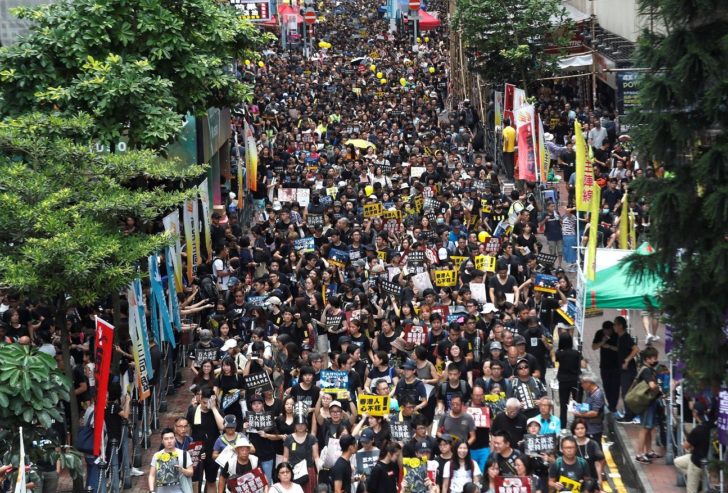 People march during a rally to demand democracy and political reforms in Hong Kong ฮ่องกง