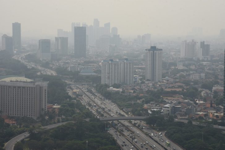 A general view of buildings as smog covers the capital city of Jakarta