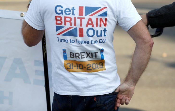 A pro-Brexit supporter stands outside the Houses of Parliament in London