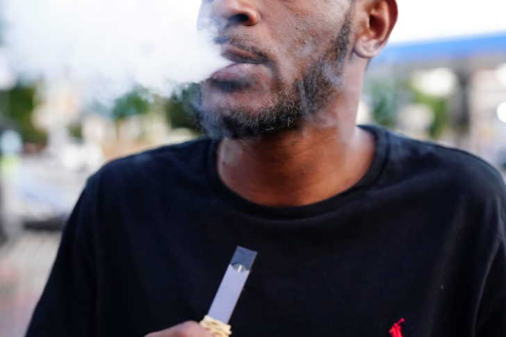A man uses a Juul vaporizer in Atlanta