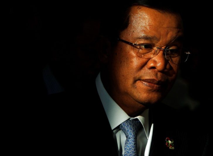 FILE PHOTO: Cambodia's Prime Minister Hun Sen leaves after the closing ceremony of the ASEM Summit in Vientiane