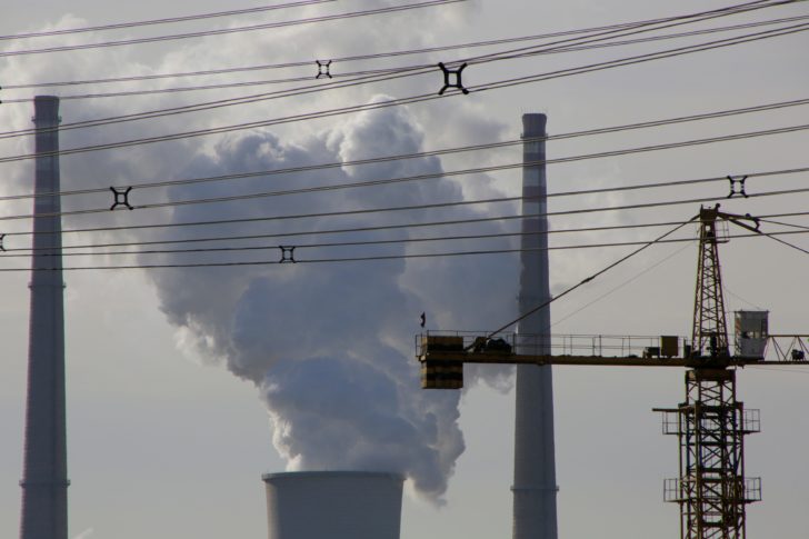 FILE PHOTO: A coal-fired power plant is pictured near a construction site in Beijing