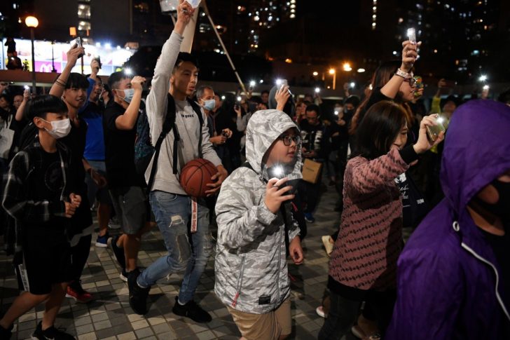People celebrate district council election results in Hong Kong