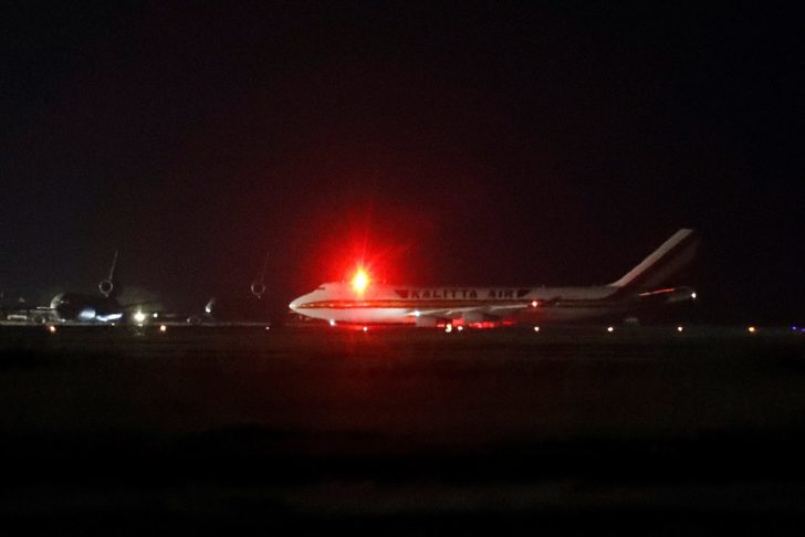 A cargo aircraft with American passengers from cruise ship Diamond Princess arrives at Travis Air Force Base in Fairfield, California
