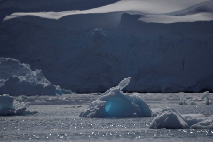 An iceberg floats along the water close to Fournier Bay, Antarctica