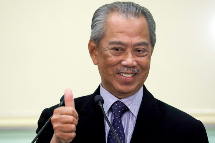 Malaysia's Prime Minister Muhyiddin Yassin gestures after his cabinet announcement in Putrajaya