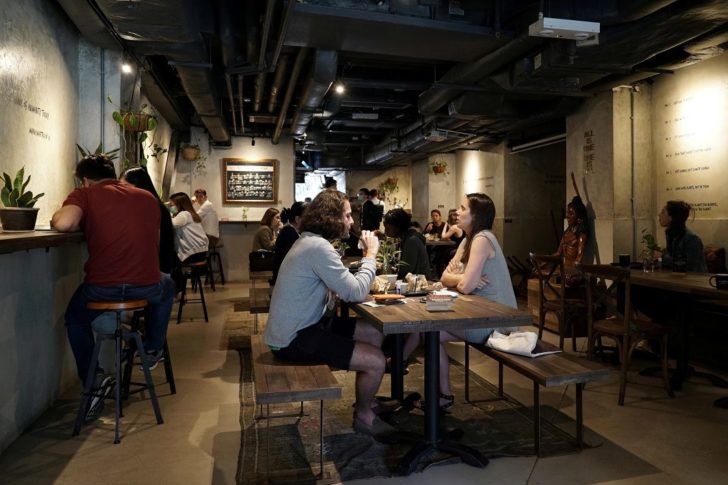 Customers eat at Mana Cafe in Hong Kong