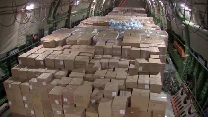 Boxes with medical equipment and masks to help fight coronavirus disease (COVID-19) are seen on board a Russian military plane outside Moscow