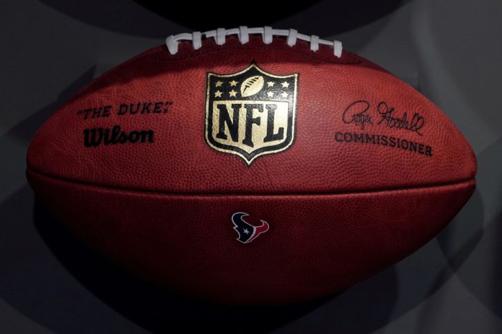 FILE PHOTO: FILE PHOTO: The NFL logo is pictured on a football at an event in the Manhattan borough of New York City